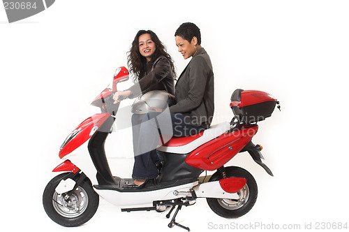 Image of couple girls talking on  scooter