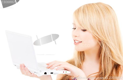 Image of teenage girl with laptop computer