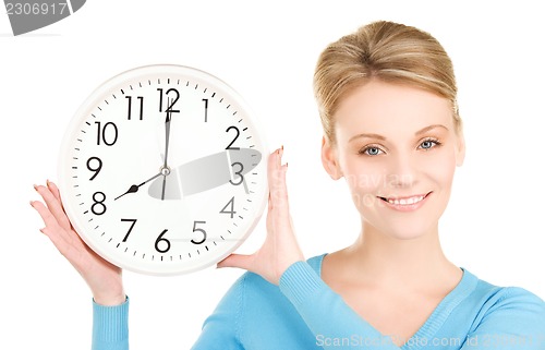 Image of woman holding big clock