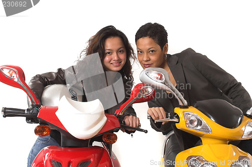 Image of girls having fun on electric scooter