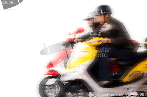 Image of couple girls racing on electric scooter