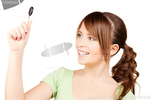 Image of happy teenage girl with car key