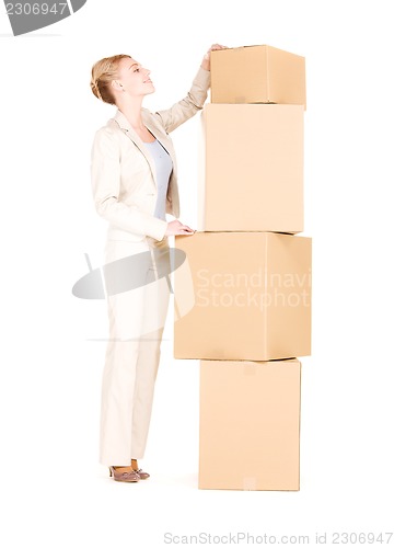 Image of businesswoman with boxes