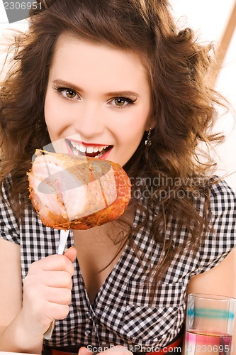 Image of young attractive woman in the kitchen