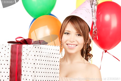 Image of party girl with balloons and gift box