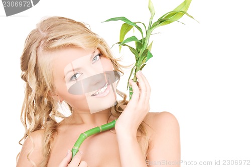 Image of woman with bamboo