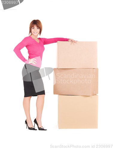 Image of businesswoman with boxes