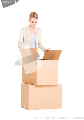 Image of businesswoman with boxes