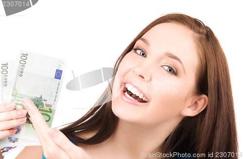 Image of lovely teenage girl with money