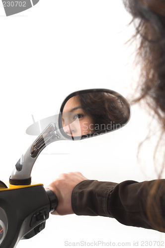 Image of girl looking in a mirror