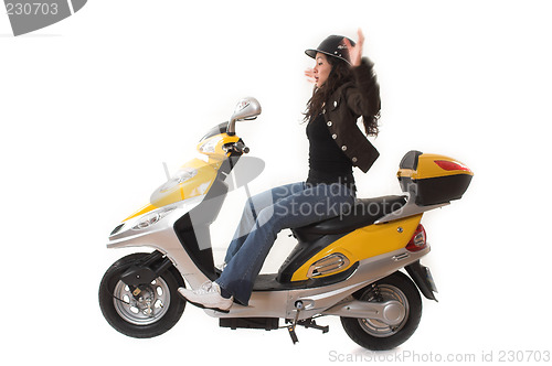 Image of girl almost falling over a scooter