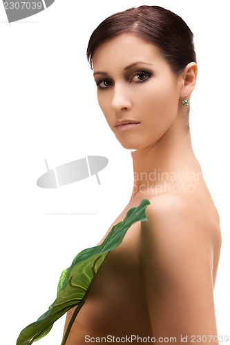 Image of woman with green leaf