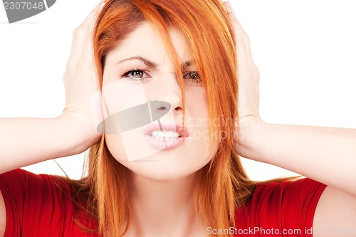 Image of unhappy redhead woman