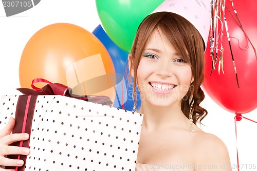 Image of party girl with balloons and gift box