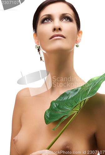 Image of woman with green leaf