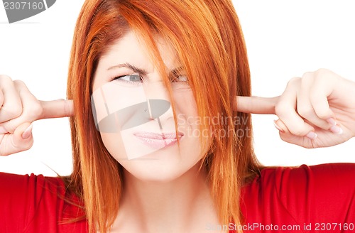 Image of unhappy redhead woman