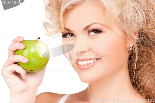 Image of young beautiful woman with green apple