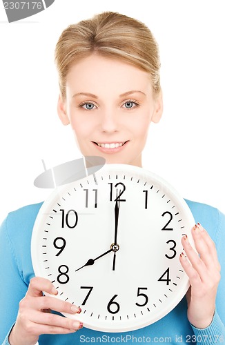 Image of woman holding big clock