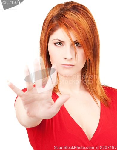 Image of woman showing stop sign