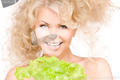 Image of happy woman with lettuce