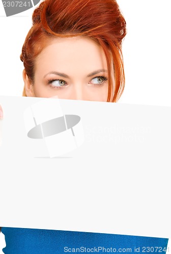 Image of redhead woman with blank board