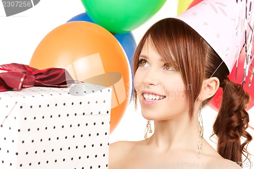 Image of party girl with balloons and gift box