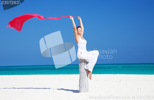 Image of happy woman with red sarong