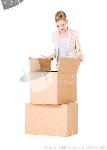 Image of businesswoman with boxes