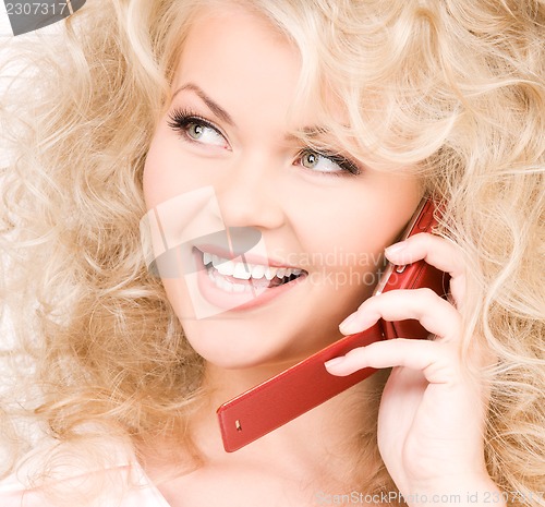 Image of happy woman with red phone