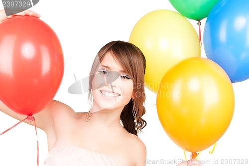 Image of happy teenage girl with balloons