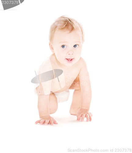 Image of crawling baby boy in diaper