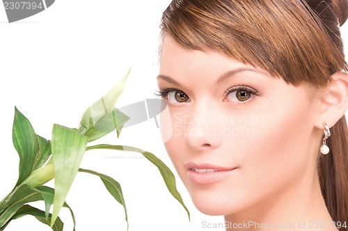 Image of woman with sprout