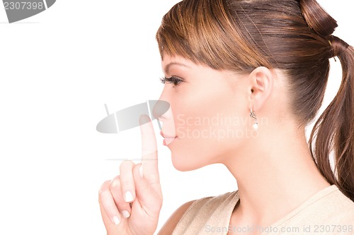 Image of finger on lips