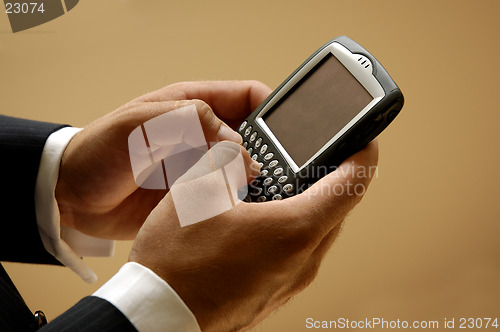 Image of Mobile Businessman Sending A Text Message