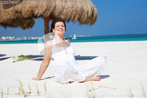 Image of happy woman on the beach