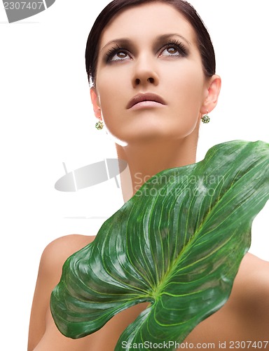 Image of woman with green leaf
