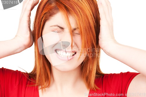 Image of unhappy redhead woman