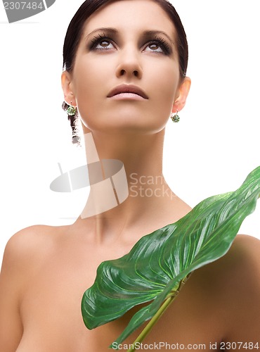 Image of woman with green leaf