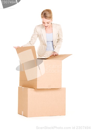 Image of businesswoman with boxes