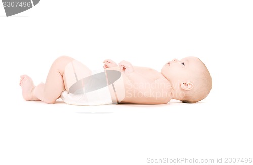 Image of laying baby boy in diaper