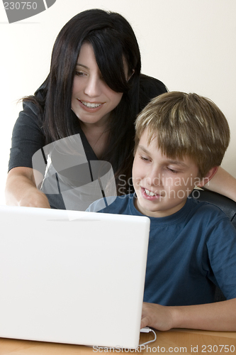 Image of Adult woman and child at computer