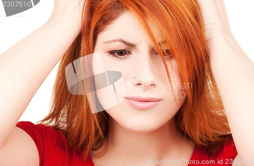 Image of unhappy redhead woman