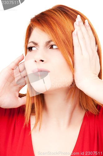 Image of unhappy redhead woman