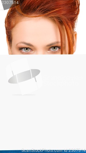 Image of redhead woman with blank board