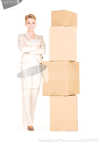 Image of businesswoman with boxes