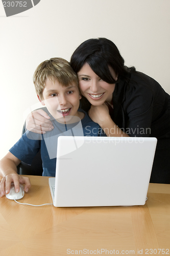 Image of Adult and child enjoying computer time