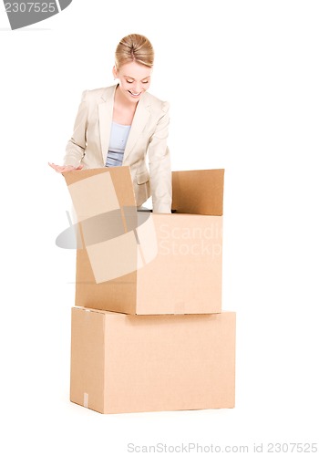 Image of businesswoman with boxes