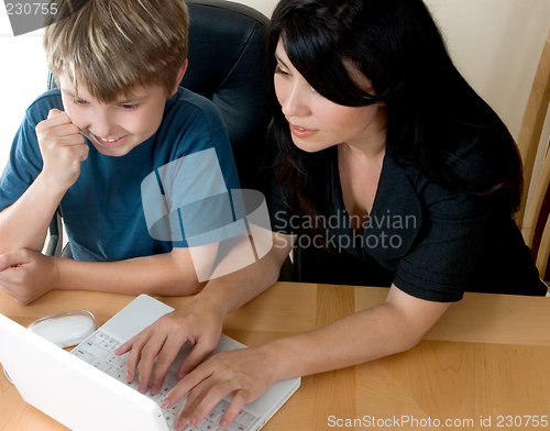 Image of Woman and child on computer