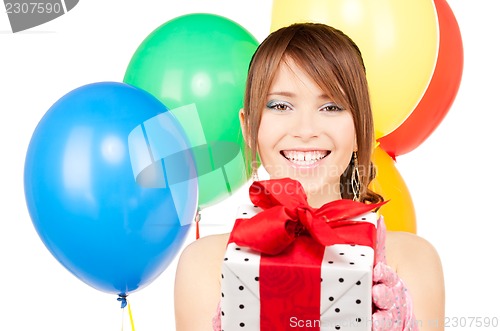 Image of party girl with balloons and gift box