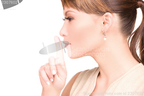 Image of finger on lips